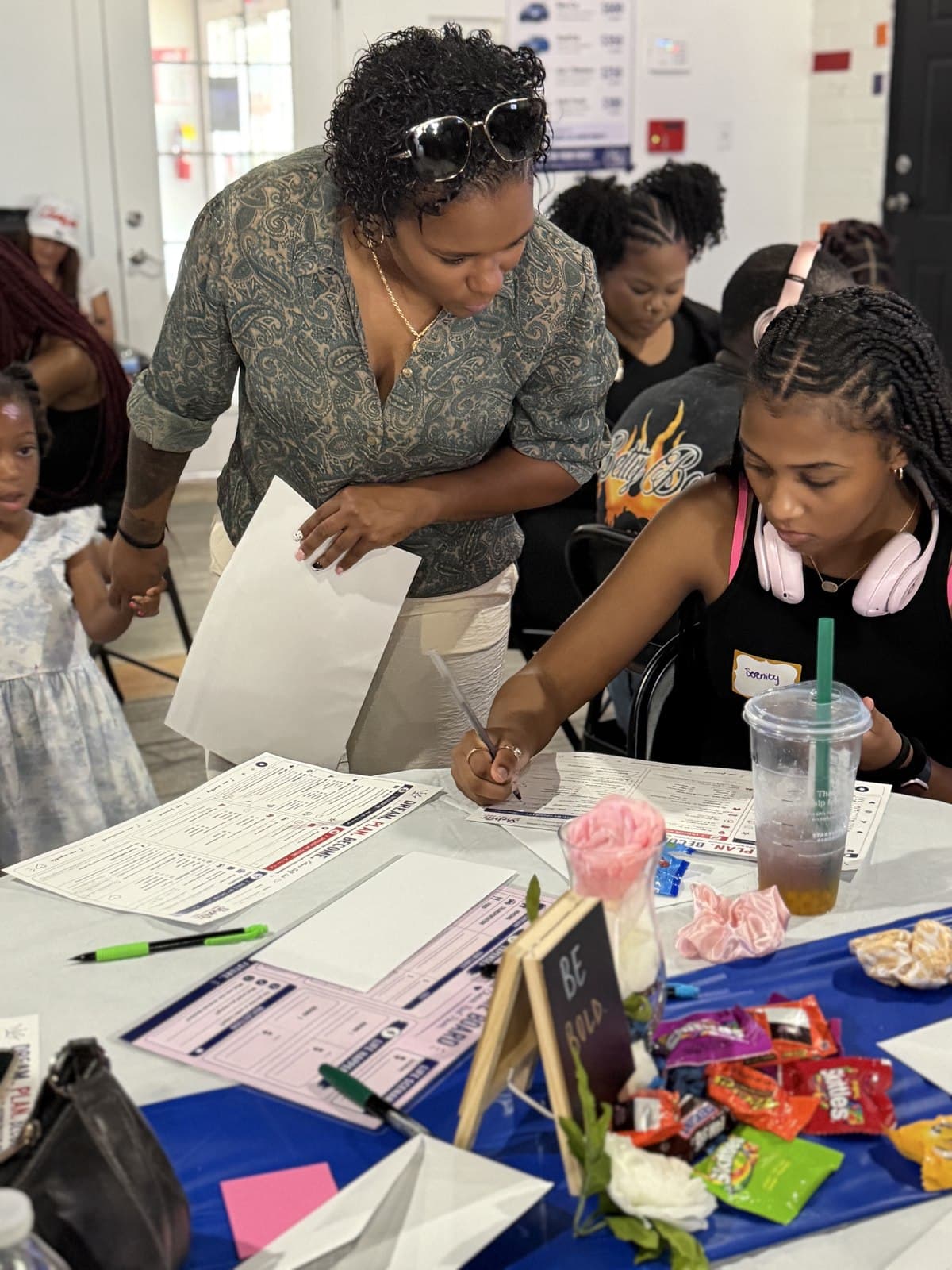 A Blueprint mentor working one-on-one with a young woman during a session