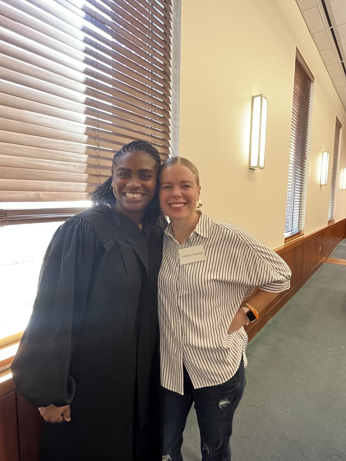A Living in Purpose staff member with a judge at the courthouse