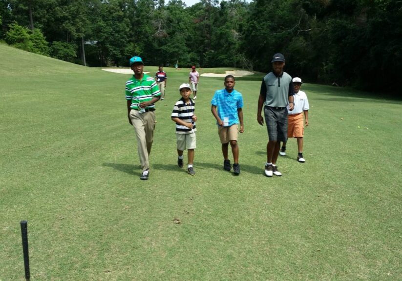 young men golf course